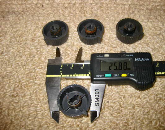 SET OF FOUR KNOBS, GREY WITH ALUMINIUM CENTRES, THOUGHT TO BE, TRUVOX