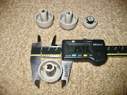 SET OF FOUR KNOBS, GREY WITH ALUMINIUM CENTRES, THOUGHT TO BE, TRUVOX