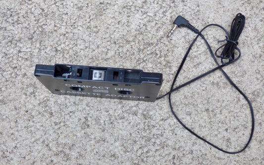 COMPACT DISC - CASSETTE ADAPTOR TO ALLOW CD PLAYER, iPOD, MP3 PLAYER TO BE USED IN CAR