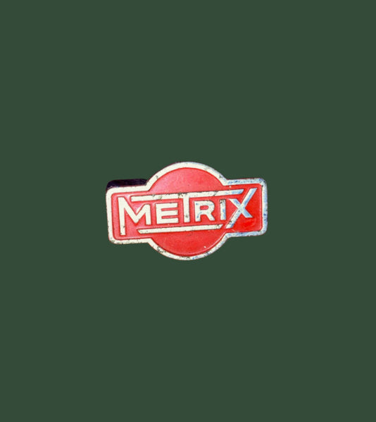 METRIX, CHROME & ENAMEL BADGE, 32 X 20mm SIZE, BOLTED STUD MOUNT