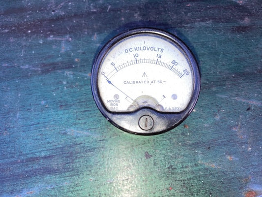 MOVING IRON METER, DC KILOVOLTS, 0 -25kV,  66mm DIA, PLUG IN,  EX MIL, DATED 1942