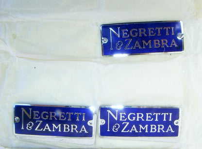NEGRETTI & ZAMBRA BLUE VITRIFIED ENAMEL & CHROMED BRASS INSTRUMENT BADGES