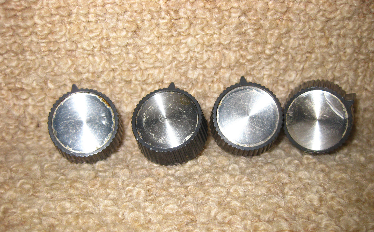 SET OF FOUR KNOBS, GREY WITH ALUMINIUM CENTRES, THOUGHT TO BE, TRUVOX