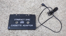 COMPACT DISC - CASSETTE ADAPTOR TO ALLOW CD PLAYER, iPOD, MP3 PLAYER TO BE USED IN CAR